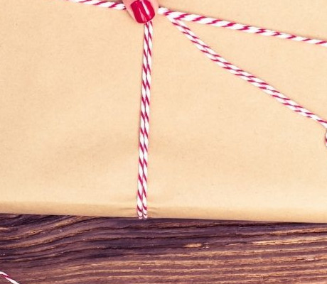 Wrapping up a book in christmas paper